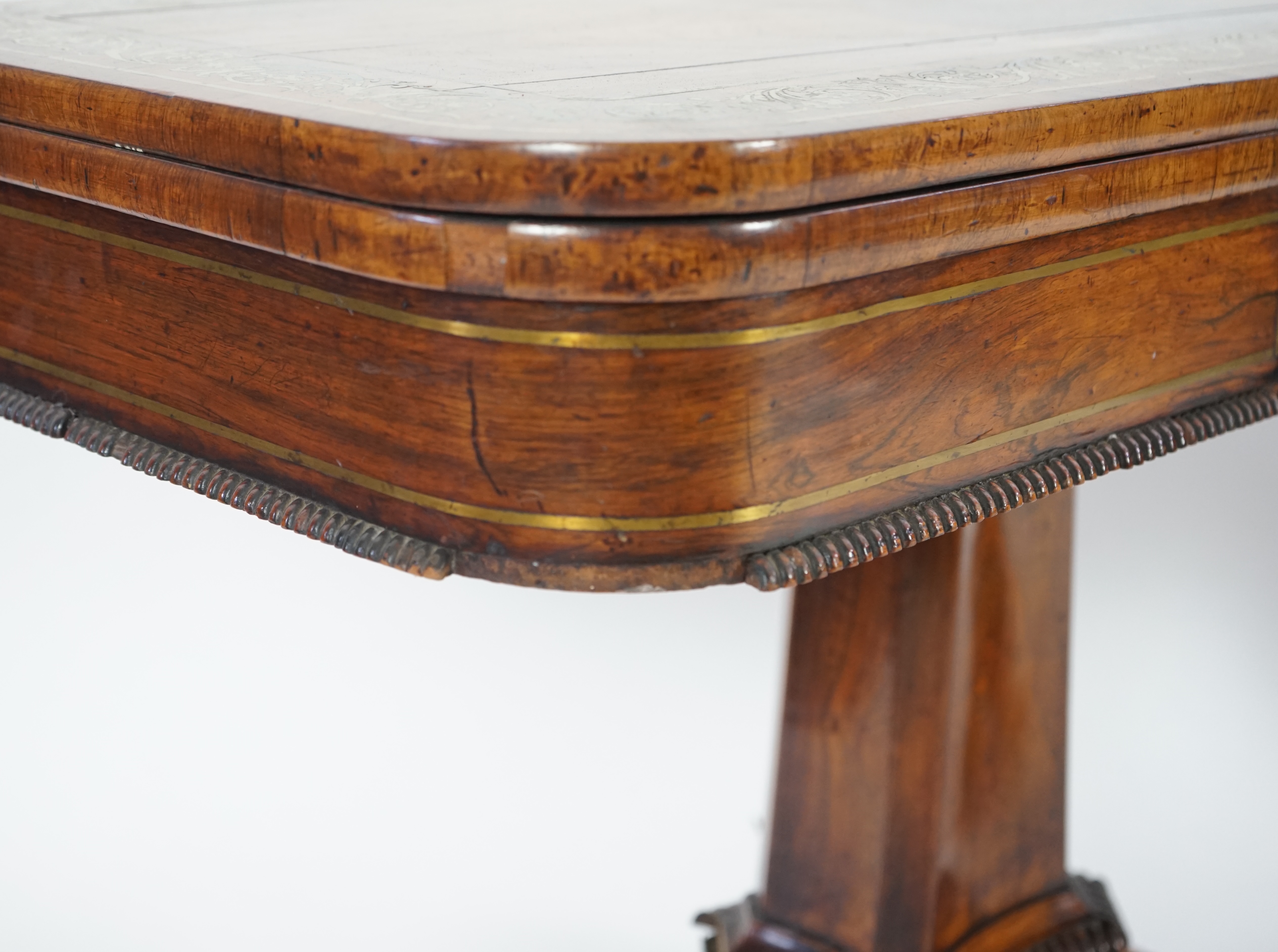A pair of Regency brass inset rosewood card tables